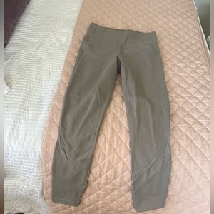 Grey athleta cropped leggings with mesh panel. Size XS